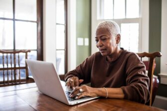 Woman-using-laptop-computer-at-home_MoMo-Productions.jpg